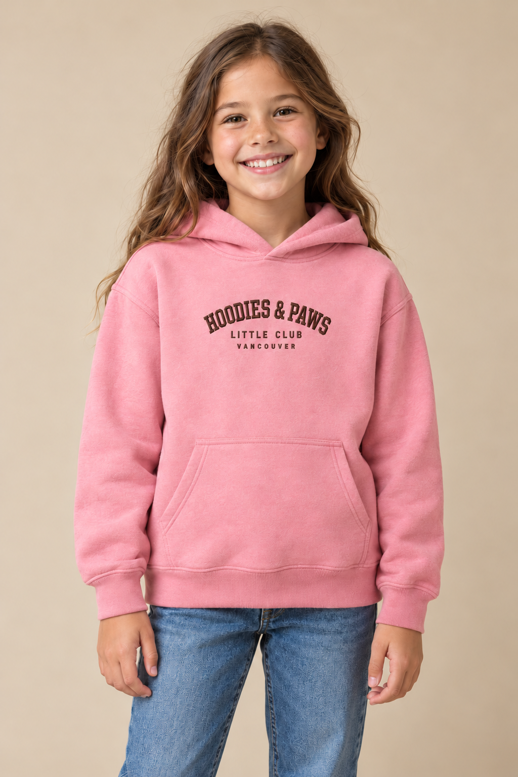 Child wearing a pink Hoodies & Paws Little Club embroidered hoodie